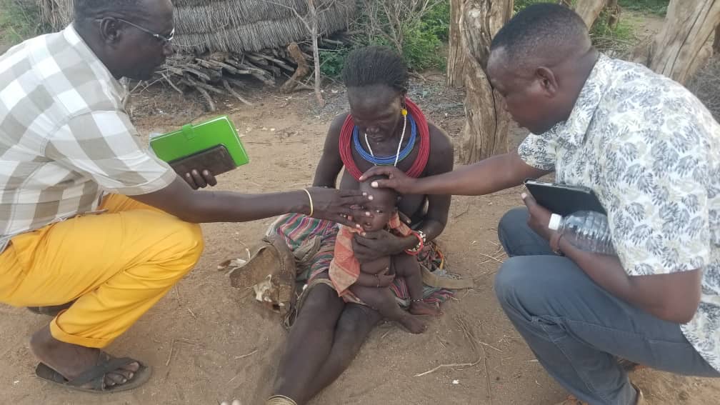 Prayers for a sick baby in Burundi.